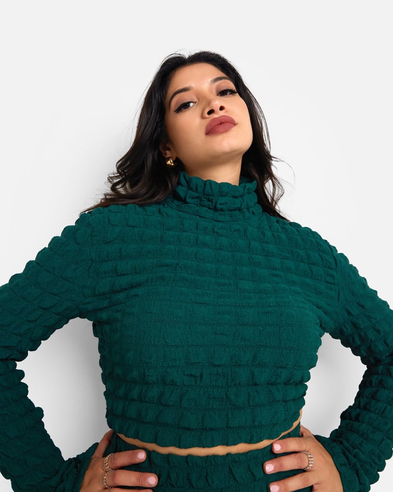 Side of a model wearing a size L Libra Popcorn Smocking High Neck Top - Pine Green in Green by Rebdolls. | dia_product_style_image_id:321413